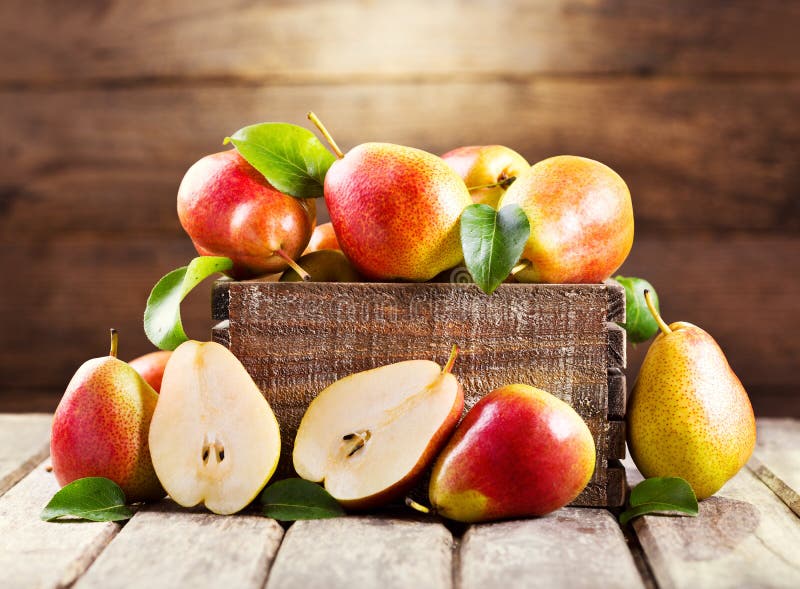 Fresh pears in wooden box