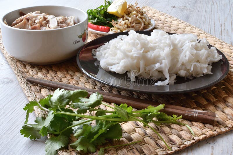 Fresh Pho Noodles on a Plate. Wide Flat Rice Noodles. Side View. Stock