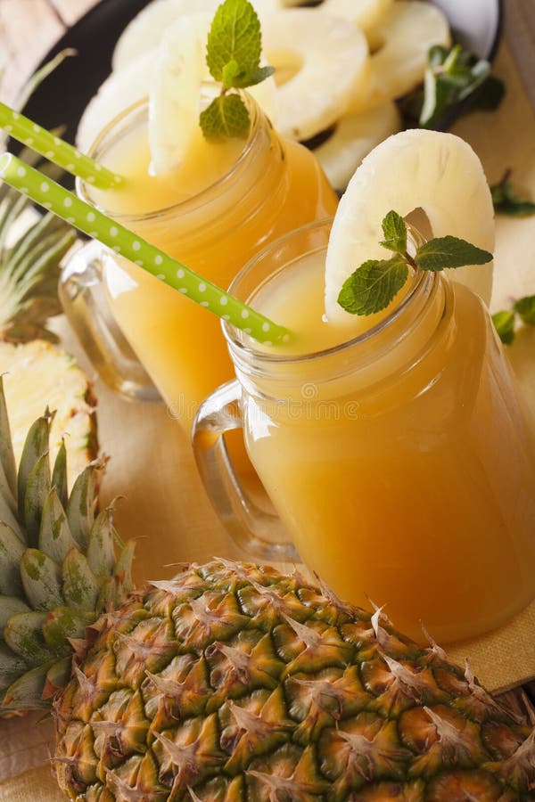 Pineapple Juice with Mint in a Glass Jar Closeup. Horizontal Top Stock