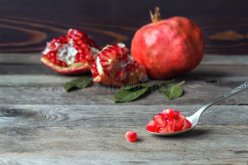 Fresh pomegranate seeds in spoon. stock image Fresh pomegranate seeds in spoon. stock image