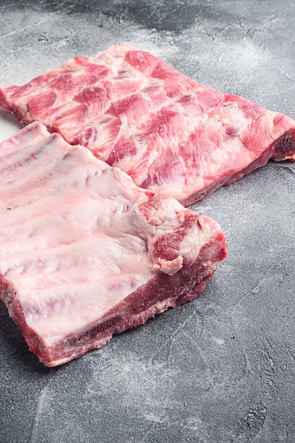 Fresh Rack of Raw Pork Spare Ribs, on Gray Stone Background Stock Image