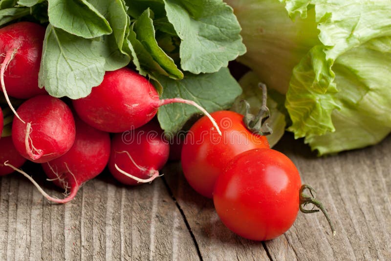 Fresh radishes and tomato stock image. Image of ingredient 19442973