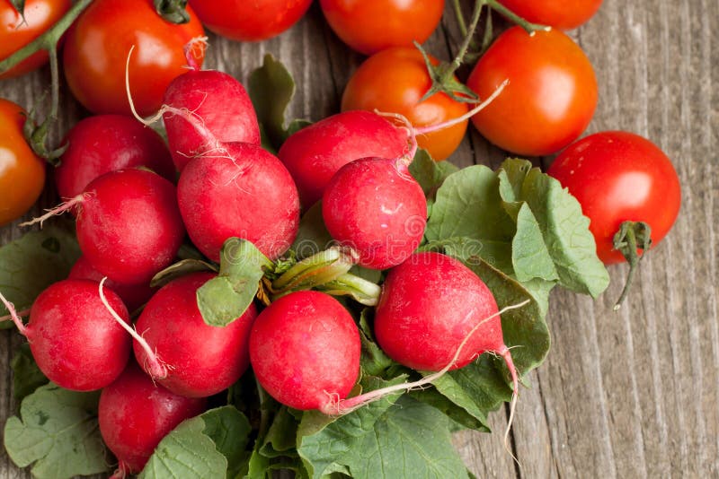 Fresh radishes and tomato