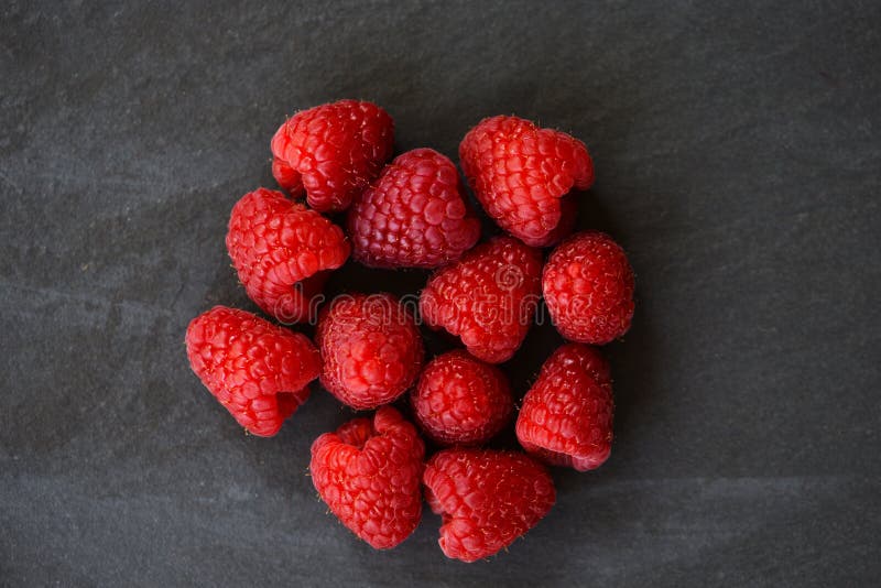 Fresh raspberries fruit dark background top view royalty free stock photo Fresh raspberries fruit dark background top view royalty free stock photo
