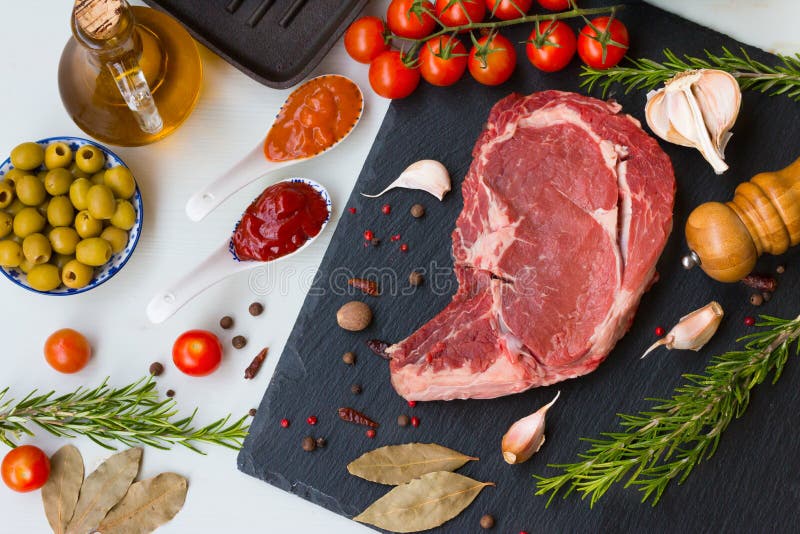 Fresh Raw Beef Entrecote with Ingredients and Sauces. Stock Image