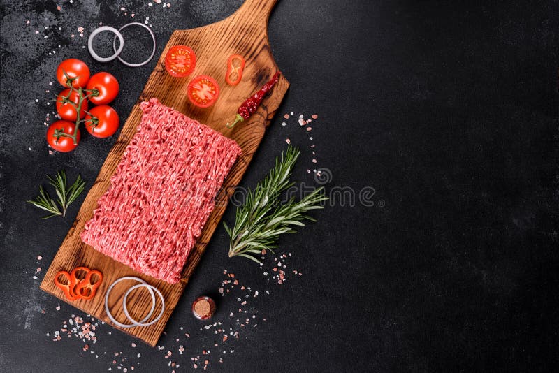 Fresh raw beef mince on a dark background