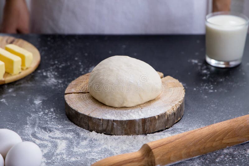 Fresh raw dough ball ready for baking with ingredients. Raw fresh yeast dough stock images, royalty-free photos and pictures