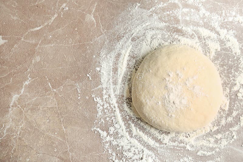Fresh raw dough with flour on table, top view. Raw fresh yeast dough stock images, royalty-free photos and pictures