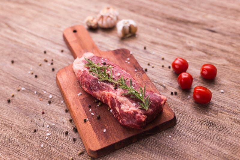 Fresh Raw Meat for Steak on Wooden Cutting Board. Stock Image Image