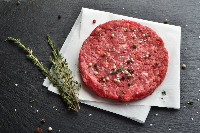 Fresh raw Prime Black Angus beef burger patty stock image