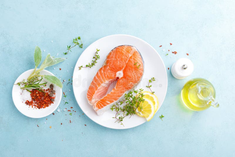 Fresh raw salmon fish steak with ingredients for cooking stock photography Fresh raw salmon fish steak with ingredients for cooking stock photography