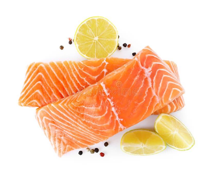 Fresh raw salmon with pepper, lime and lemon on background, top view. Fish delicacy royalty free stock photo