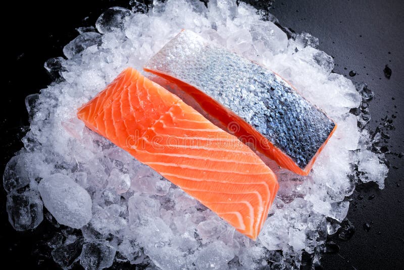 Fresh Raw two salmon fillet on ice