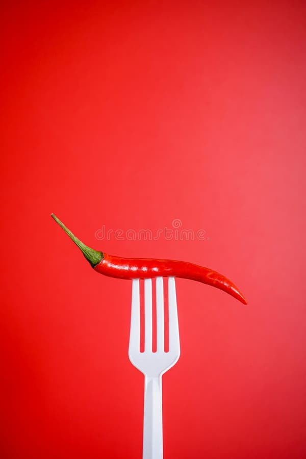 Red Chilli on White Plastic Fork with Red Background Stock Image Image of cooking, cayenne