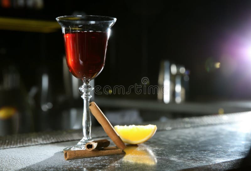 Fresh Red Cinnamon Whiskey Alcoholic Cocktail on Bar Counter. Stock Photo Image of dark