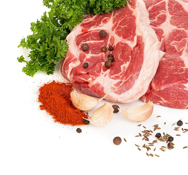 Fresh Red Meat with Spices and Parsley Closeup on a White Background