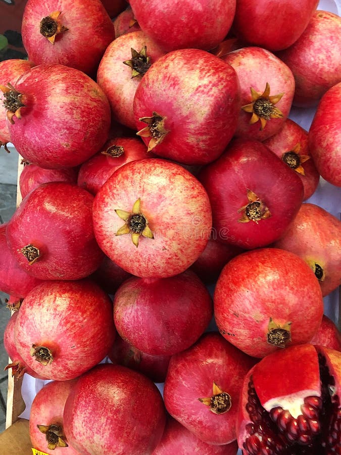 Pomegranates at the market stock photo. Image of health 55790690