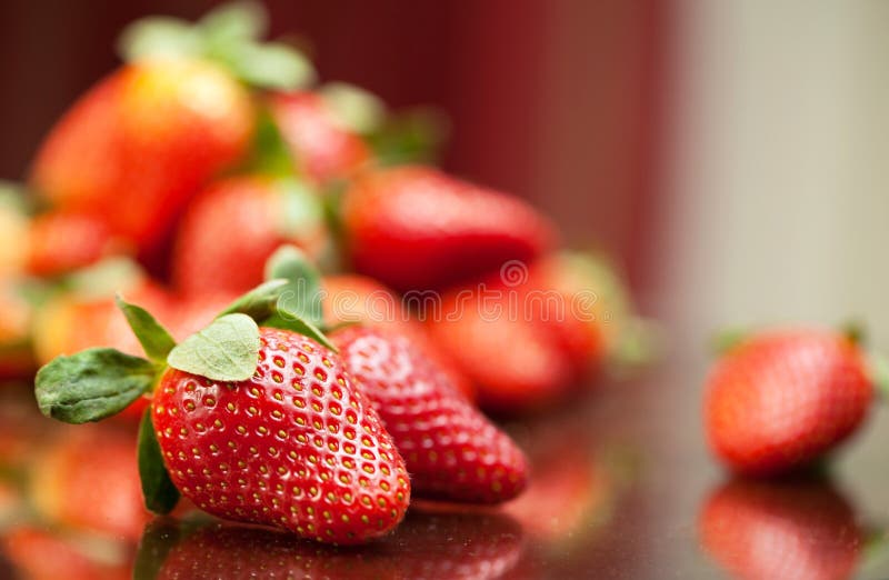 Fresh red strawberries on the table stock photos
