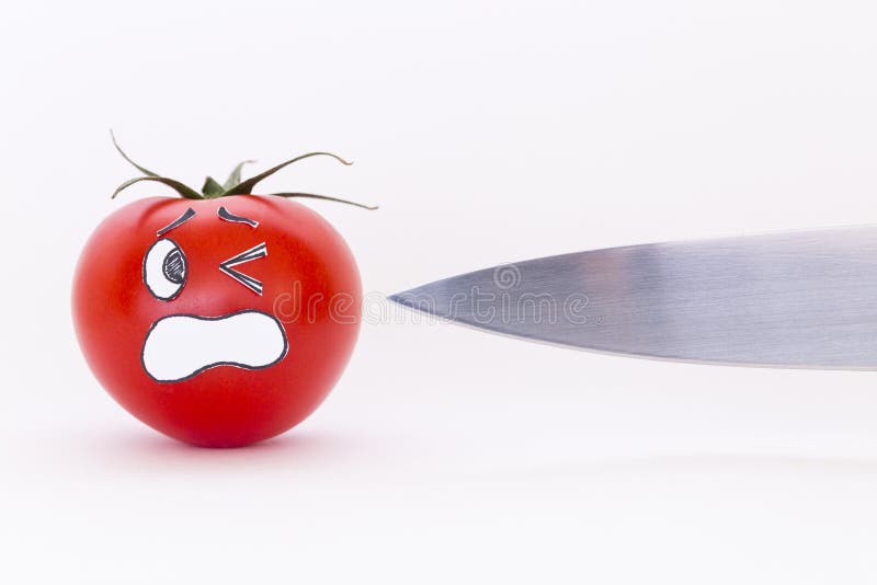 Fresh Red Tomato with Scared Face and Sharp Knife Blade Stock Image