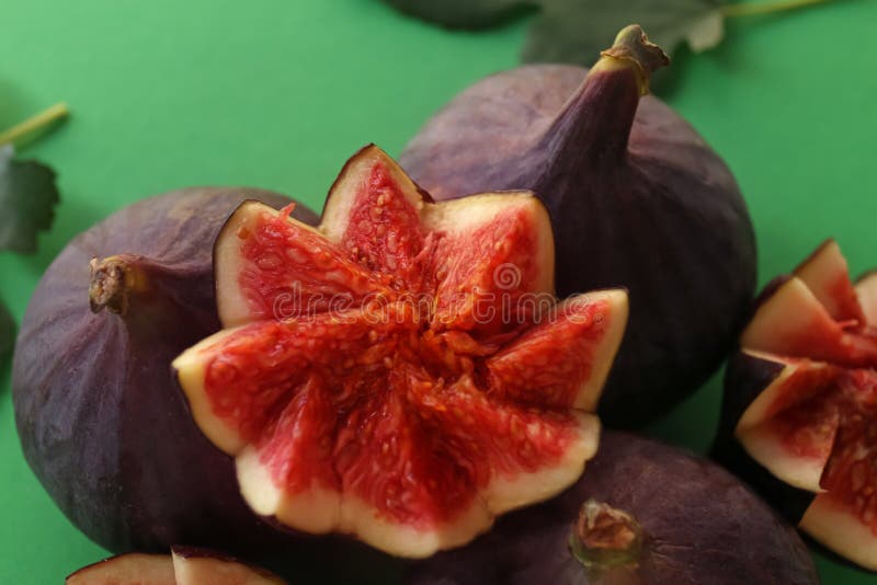 Fresh Ripe Purple Figs On Color Background, Closeup Stock Photo Image