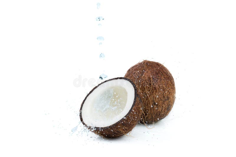 Fresh ripe tropical coconuts with water isolated on white