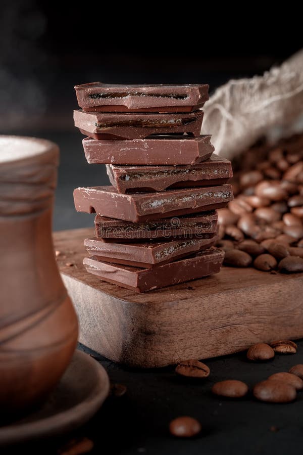 Fresh Roasted Coffee Beans and Stack of Brown Chocolate. Stock Image