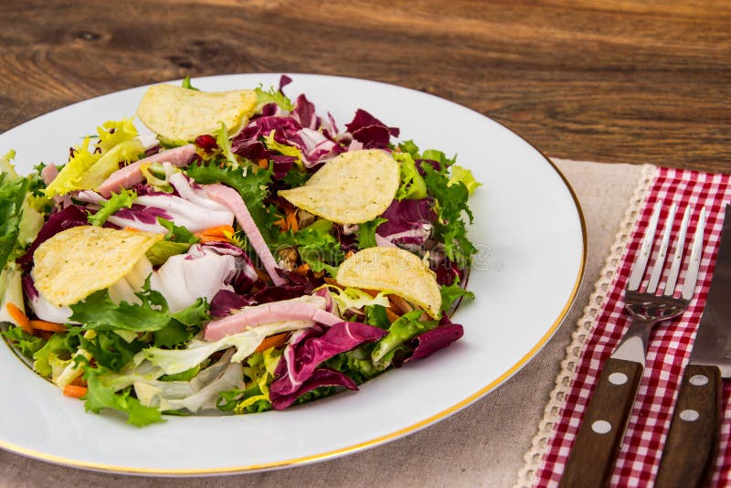 Fresh salad mix with ham and chips