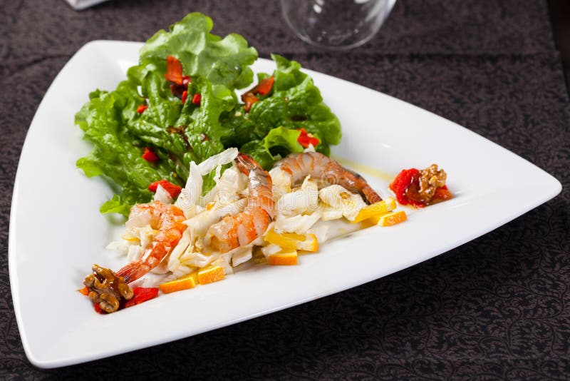 Fresh salad with shrimps and walnuts royalty free stock photos