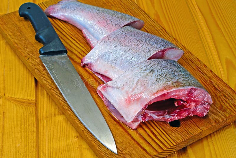 Fresh silver carp and kitchen knife