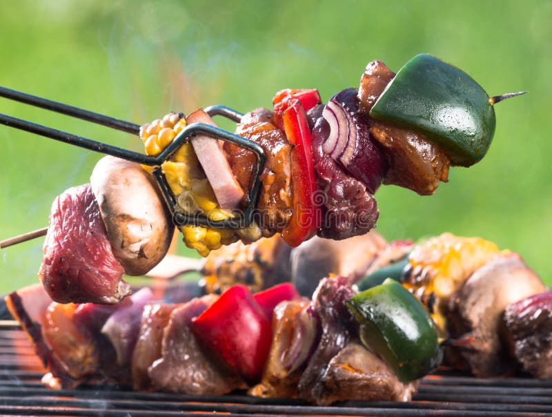 Fresh skewers on the grill, close-up. Roasted skewer grill stock images, royalty-free photos and pictures