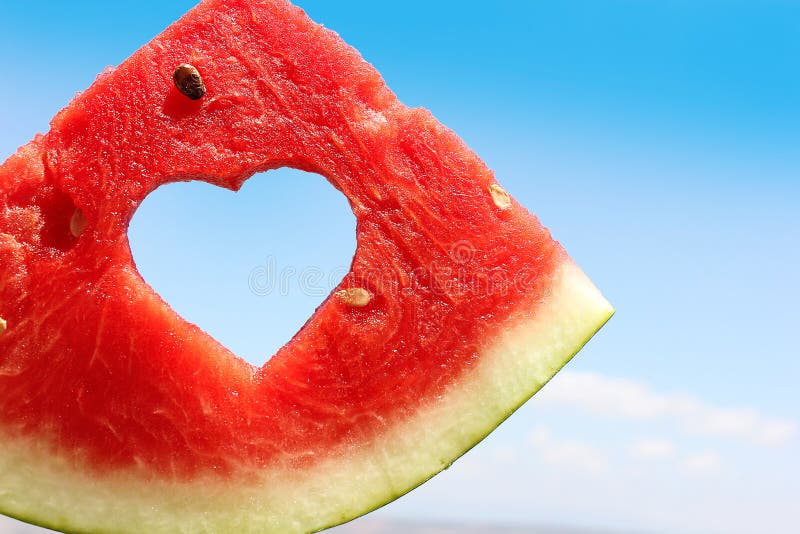 Fresh slice of watermelon with heart inside stock images