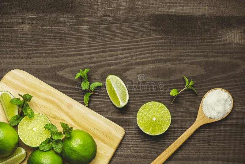 Fresh sliced lime and salt on wood table stock photos Fresh sliced lime and salt on wood table stock photos