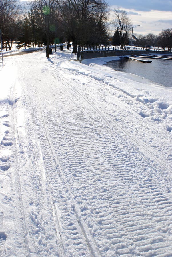 Fresh Snowmobile Tracks stock image. Image of snow, peaceful 85790523