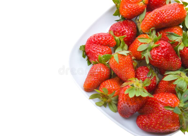 Fresh strawberries on a platter isolated on white stock photography