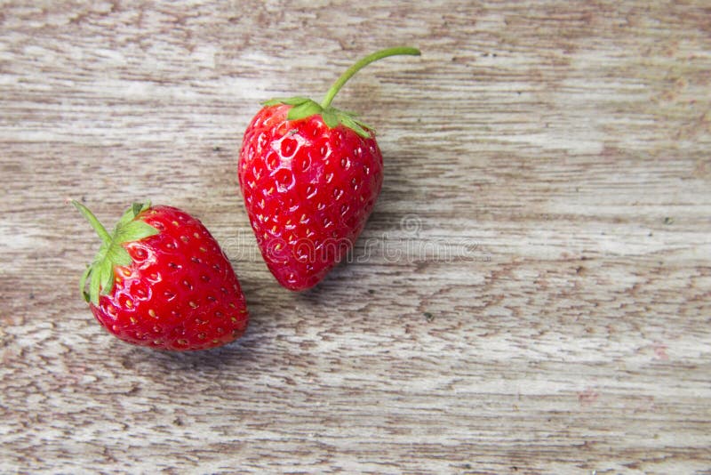 Fresh strawberries on wooden table,Red strawberry prepatation to make Strawberry Juice.Healthy and delicious organic fruit royalty free stock image Fresh strawberries on wooden table,Red strawberry prepatation to make Strawberry Juice.Healthy and delicious organic fruit royalty free stock image