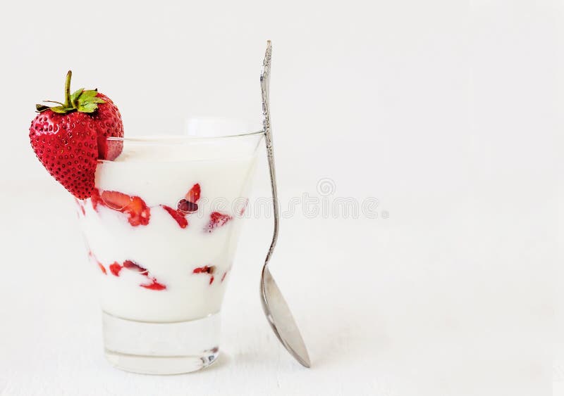 Fresh strawberry on a glass with dessert yogurt and strawberry l