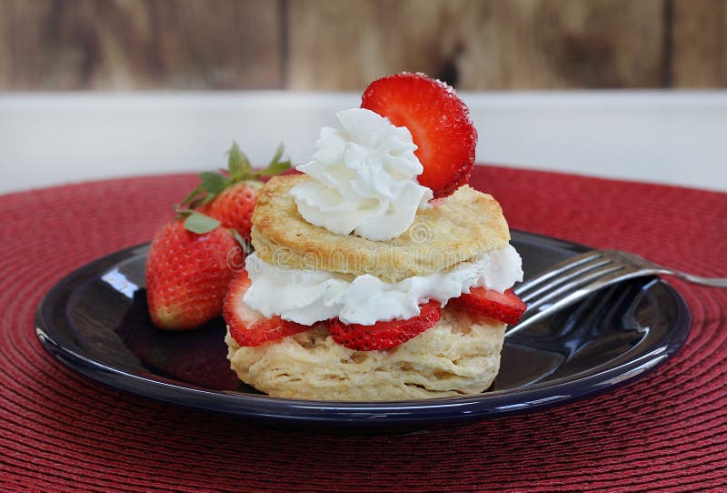 Fresh strawberry shortcake with homemade biscuits and garnished