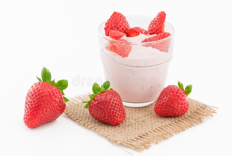 Fresh strawberry with yogurt in a glass isolated