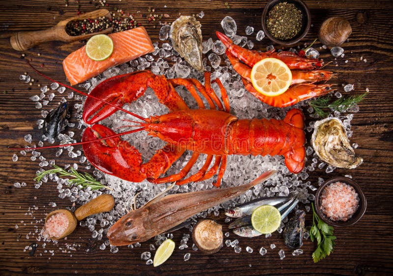 Fresh tasty seafood served on old wooden table. Top view. Close-up.