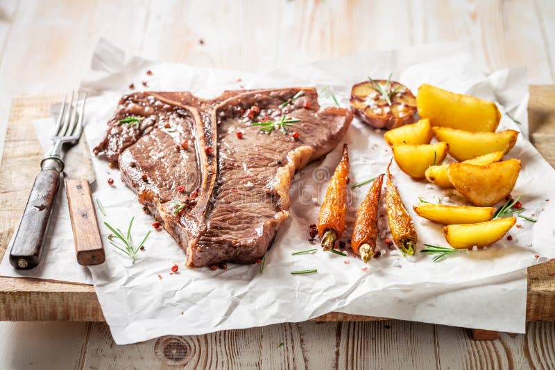 Fresh Tbone Steak Seasoned with Salt and Rosemary Stock Photo Image