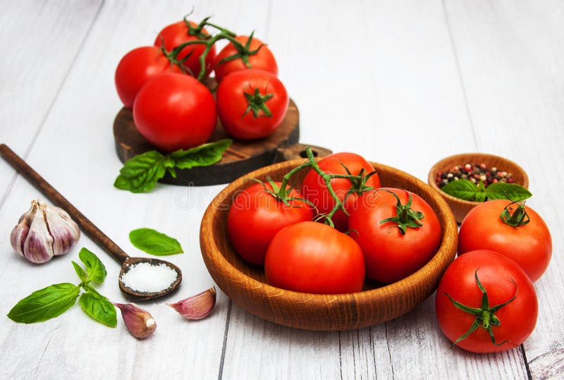 Fresh tomatoes on a table stock photo. Image of fruit 111295974