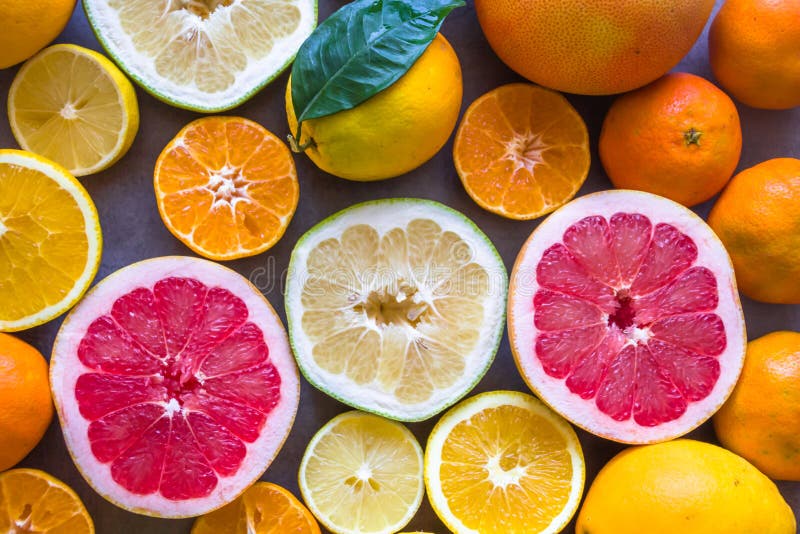 Fresh variety of citrus fruits half cut