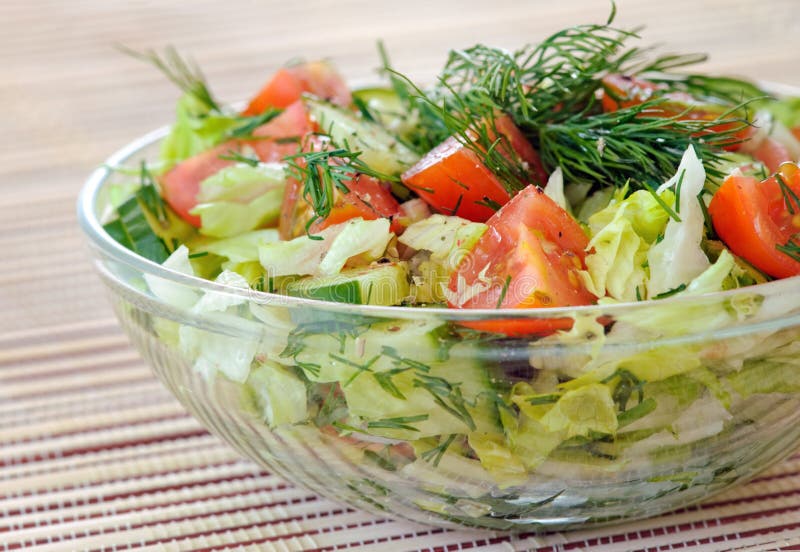 Fresh vegetable salad with tomato, lettuce, cucumber