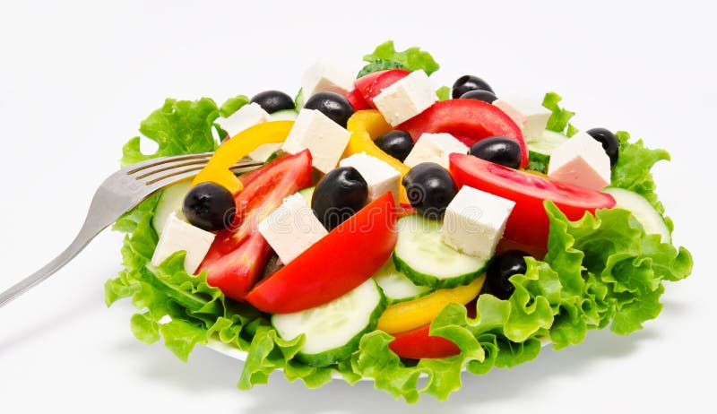 Fresh vegetable salad with fork isolated on a white