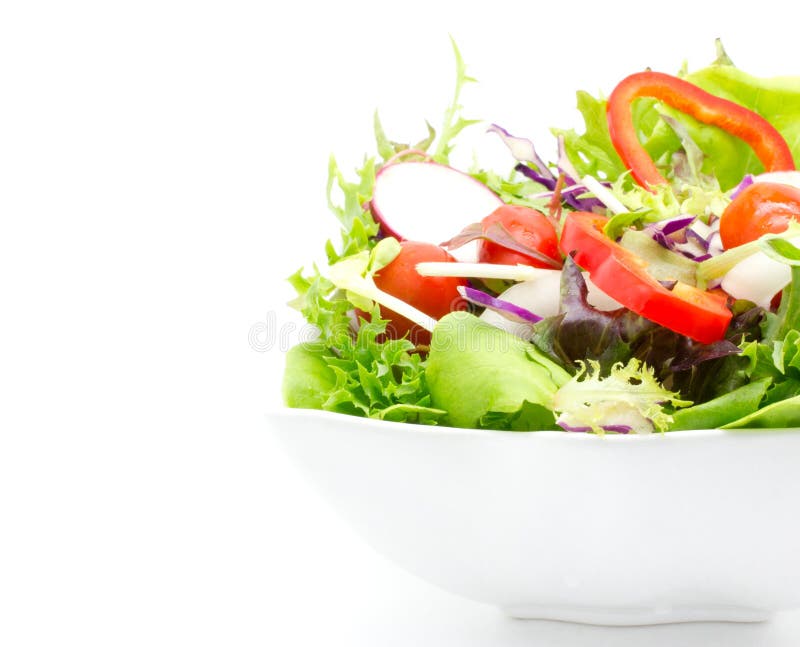 Fresh vegetable salad isolated on white.