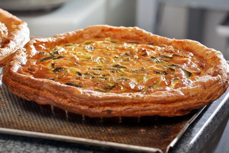 Fresh Vegetable Tart Removed from the Oven at the Bakery Stock Photo