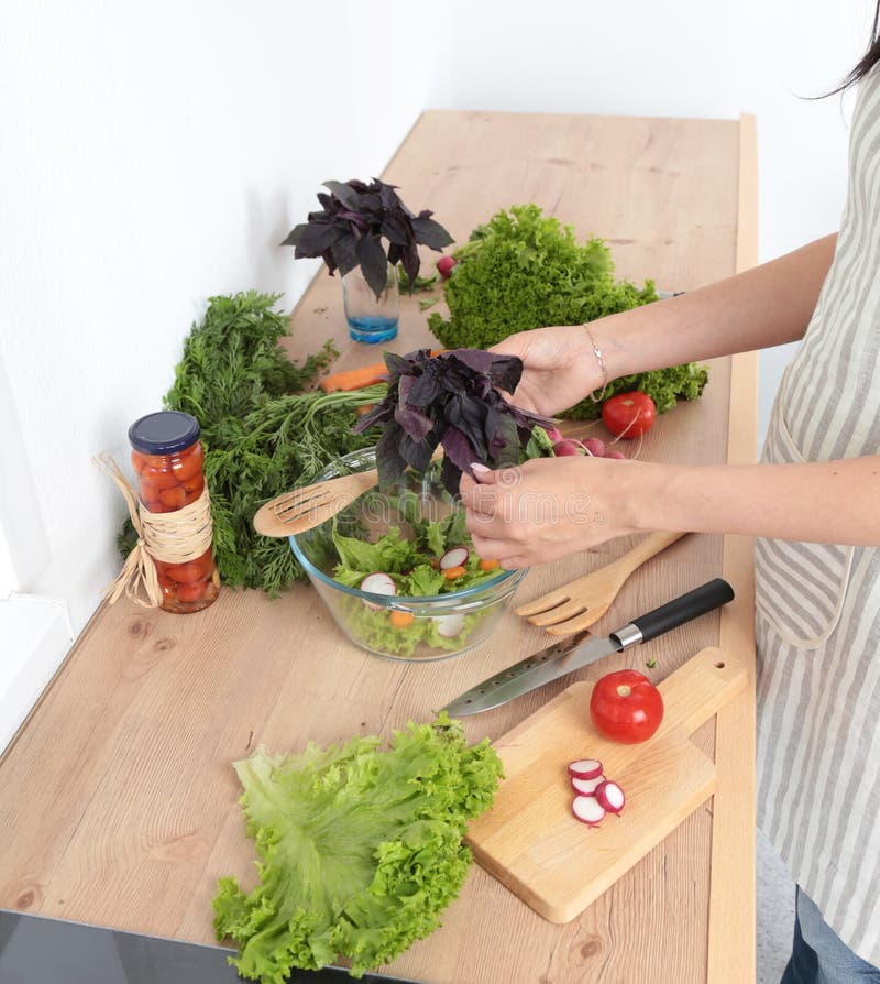 Fresh Vegetables on the Cutting Board, Salad in a Glass Dish. Concept