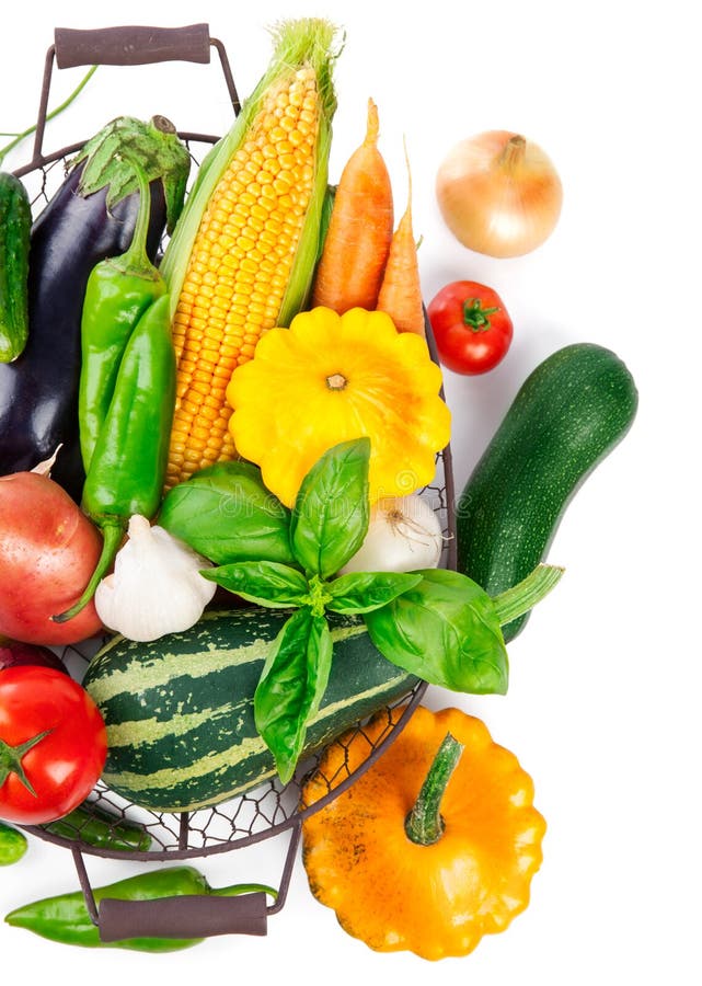 Fresh Vegetables Harvest in Basket with Green Leaves Stock Photo