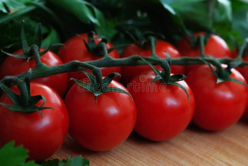 Fresh vegetables on the table. Food background. Close up. Cherry tomatoes, a bunch of parsley, chopped red pepper, garlic and stock photography Fresh vegetables on the table. Food background. Close up. Cherry tomatoes, a bunch of parsley, chopped red pepper, garlic and stock photography
