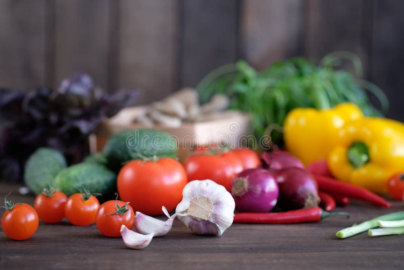 Fresh vegetables: tomatos, cucumbers, peppers, onions, garlic and green seasonings